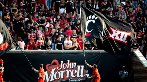 Cincinnati Bearcats Cheerleaders waive flags with the Big 12 logo in the second half of the NCAA football game between Cincinnati Bearcats and Murray State Racers on Saturday, Sept. 11, 2021, at Nippert Stadium in Cincinnati.